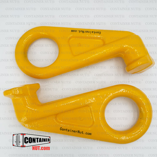 Two vibrant yellow metal tools with hook-like ends, branded with ""Container Nut."" Both feature circular cutouts and are showcased on a plain background adorned with a repeating ""CONTAINER NUT®"" watermark, along with the brand's logo in the bottom left corner. The product is identified as the hooks in the Chain Sling + Right/Left Hooks Bundle.