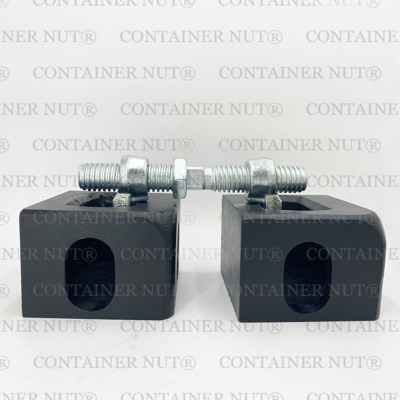 Load image into Gallery viewer, Bridge Fitting demo. Two silver rectangular blocks with holes and threaded bolts secured with nuts placed on top, resembling bridge fittings, set against a grey background with &quot;Container Nut®&quot; repeatedly printed in grey.
