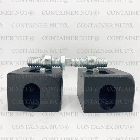 Bridge Fitting demo. Two silver rectangular blocks with holes and threaded bolts secured with nuts placed on top, resembling bridge fittings, set against a grey background with "Container Nut®" repeatedly printed in grey.