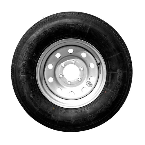 A close-up image of a 8 Lug Tire featuring a black tire with a silver, multi-hole rim. The tire's sidewall prominently displays the brand name 