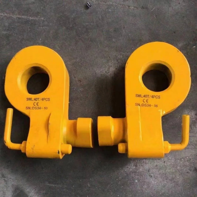 Load image into Gallery viewer, Two yellow Bottom Lifting Lugs from Container Nut, heavy-duty and featuring CE markings with serial numbers (&quot;SWL40T/4PCS SN-DS34-53&quot; and &quot;SWL40T/4PCS SN-DS34-56&quot;), lie on a gray surface. The lugs have large circular openings and pinned shaft fittings.
