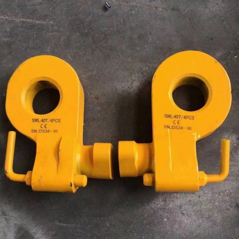 Load image into Gallery viewer, Two yellow Bottom Lifting Lugs from Container Nut, heavy-duty and featuring CE markings with serial numbers (&quot;SWL40T/4PCS SN-DS34-53&quot; and &quot;SWL40T/4PCS SN-DS34-56&quot;), lie on a gray surface. The lugs have large circular openings and pinned shaft fittings.
