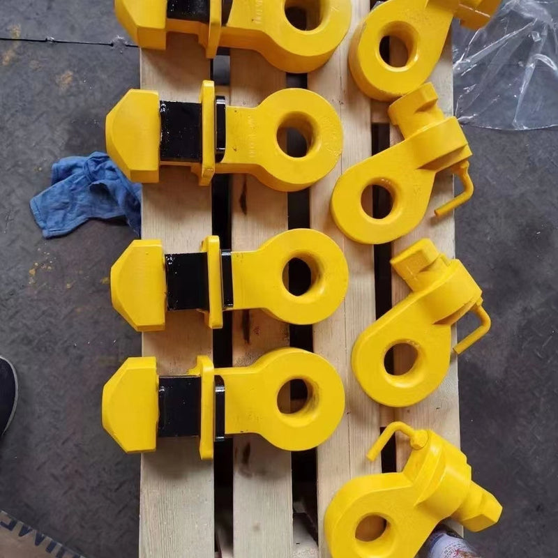 Load image into Gallery viewer, Multiple yellow Shipping Container Top Lifting Lug.
