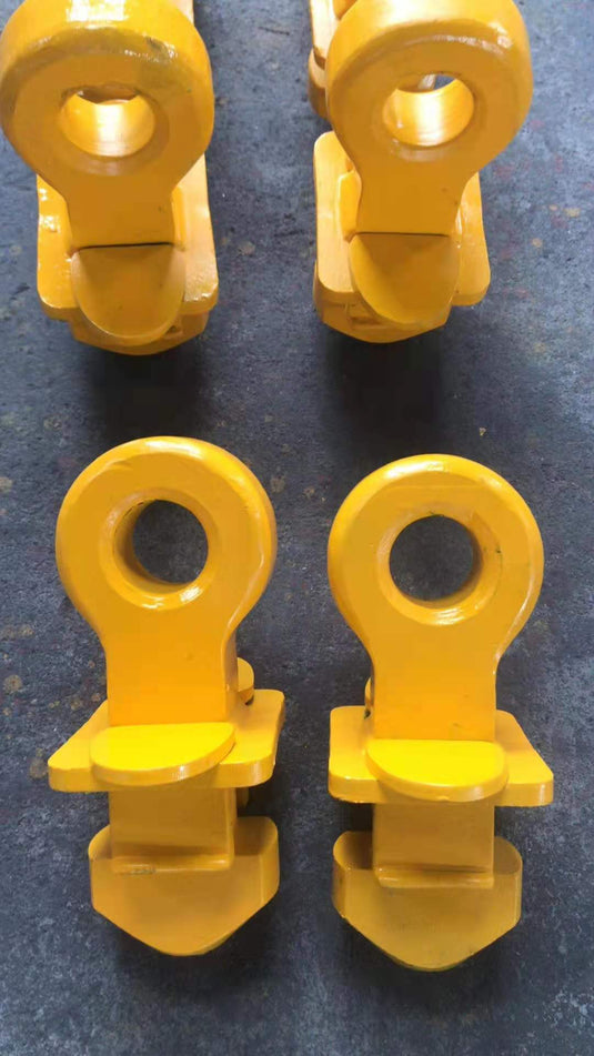 Multiple yellow Shipping Container Top Lifting Lug.