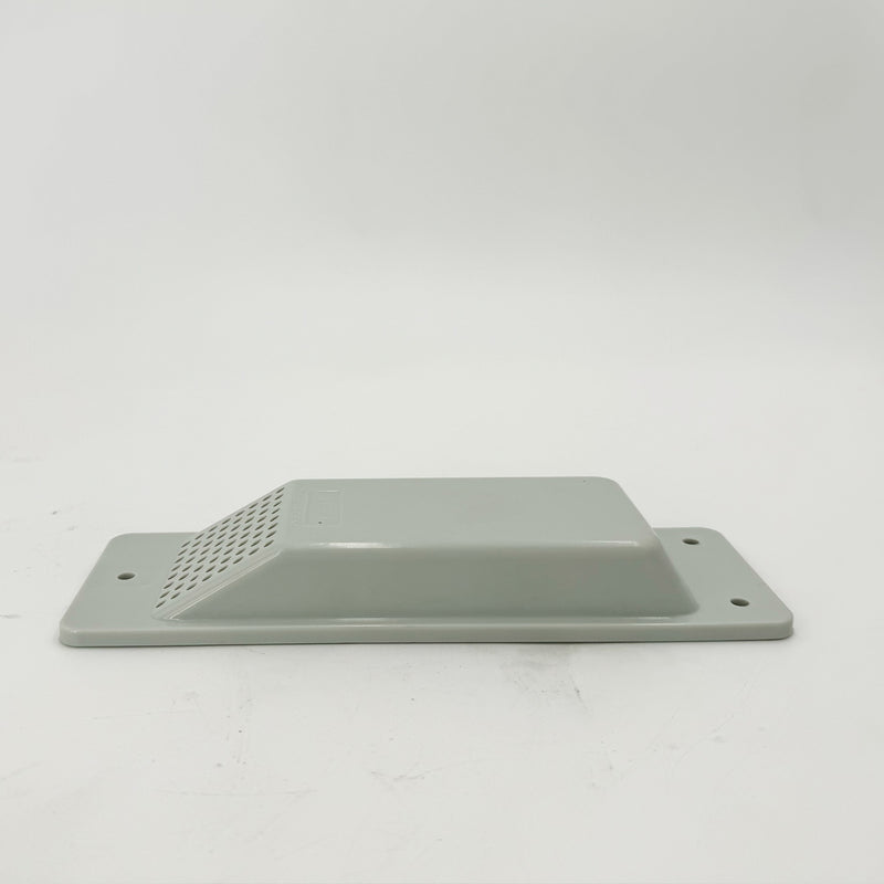 Load image into Gallery viewer, A silver ABS plastic Air Vent by Container Nut lies flat against a gray background. The rectangular vent cover features a slotted area for ventilation and has four mounting holes, one at each corner, for securing it in place.
